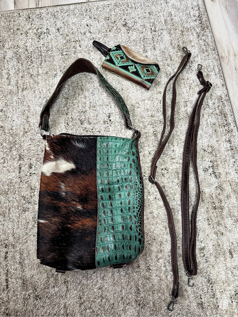 Holy Cow Couture Brown & Turquoise Cowhide Purse with backpack strap attachment.